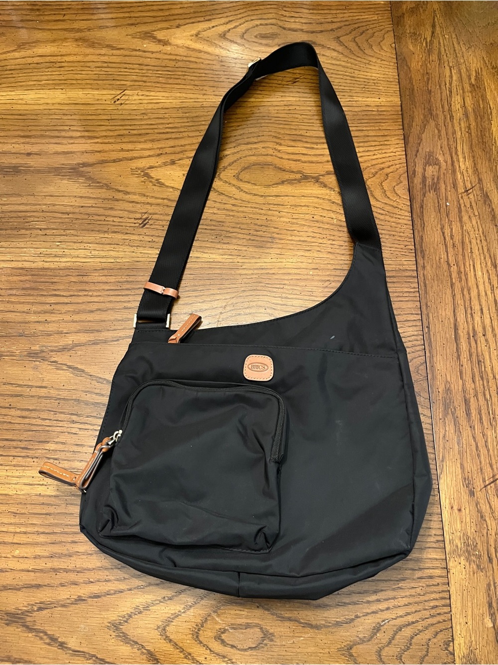 Bric's X-Bag Hipster Crossbody bag in black featuring tan leather trim